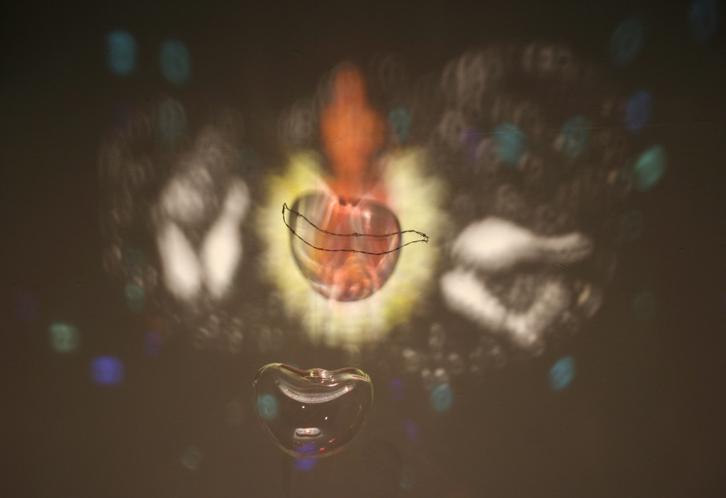 Blown glass, barbed wire, glass fragments on mirror