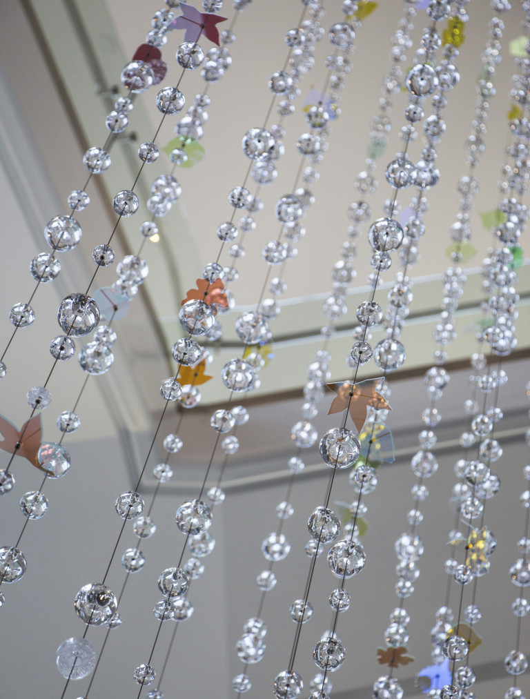 Hand-sculpted glass and dichroic glass suspended on stainless steel cables