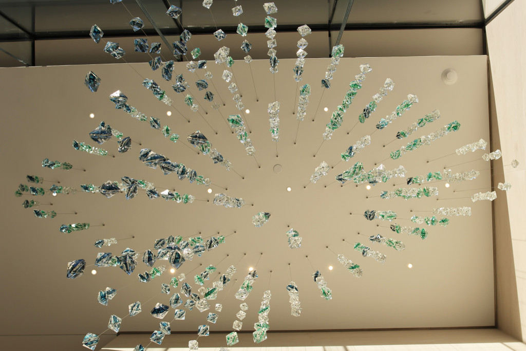 view from right below of the glass suspended sculpture in the morning