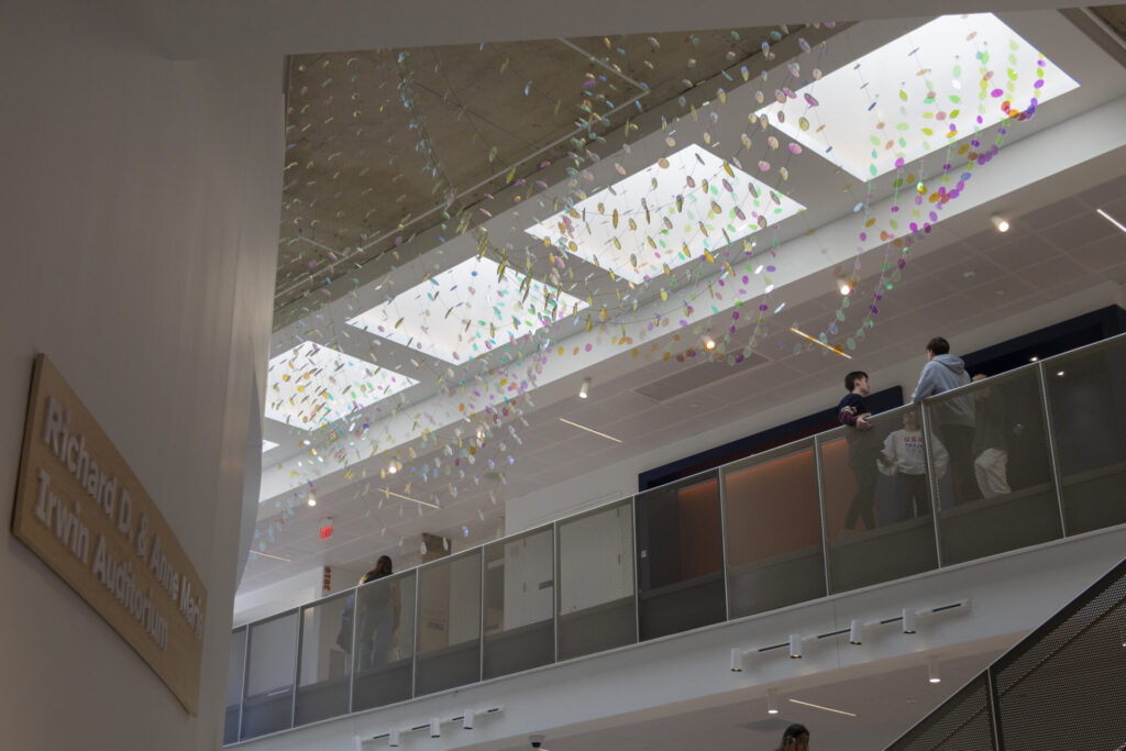 Looking up from the ground floor to the skylight. The colorful Glass suspended sculpture with 2,000 dichroic glass flower petals and leaves is visible inside Steven Wymer Hall, University of Illinois Urbana-Champaign