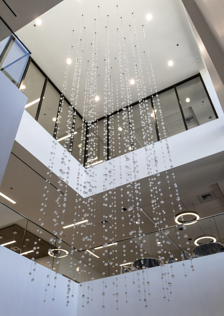 Waterfall: Ice to Clarity, suspended glass installation by Kana Tanaka at Enloe Health Gonzales Comprehensive Cancer Center in Chico, California