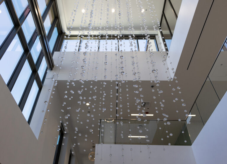 Waterfall: Ice to Clarity, suspended glass installation by Kana Tanaka at Enloe Health Gonzales Comprehensive Cancer Center in Chico, California