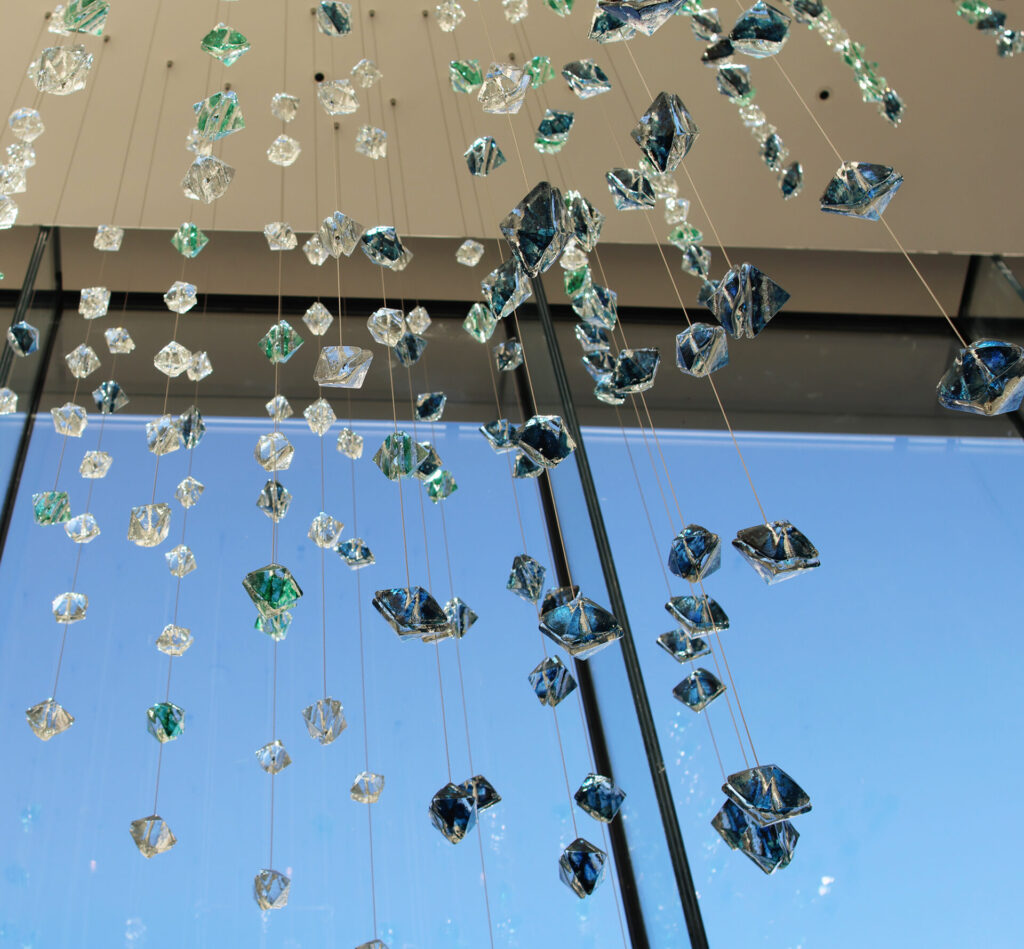 Detail view of the suspended sculpture from interior atrium, mid day