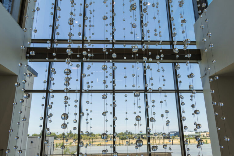 Waterfall: Ice to Clarity, suspended glass installation by Kana Tanaka at Enloe Health Gonzales Comprehensive Cancer Center in Chico, California