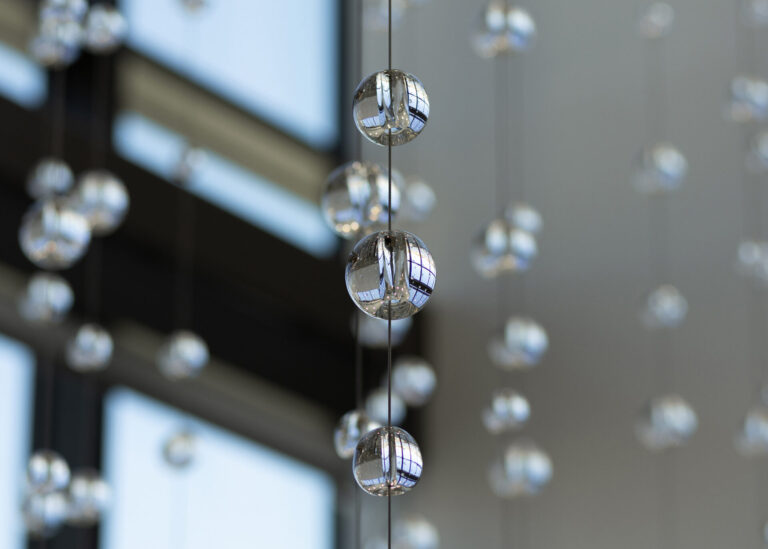 Waterfall: Ice to Clarity, suspended glass installation by Kana Tanaka at Enloe Health Gonzales Comprehensive Cancer Center in Chico, California