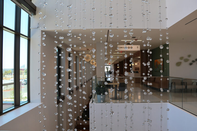 Waterfall: Ice to Clarity, suspended glass installation by Kana Tanaka at Enloe Health Gonzales Comprehensive Cancer Center in Chico, California