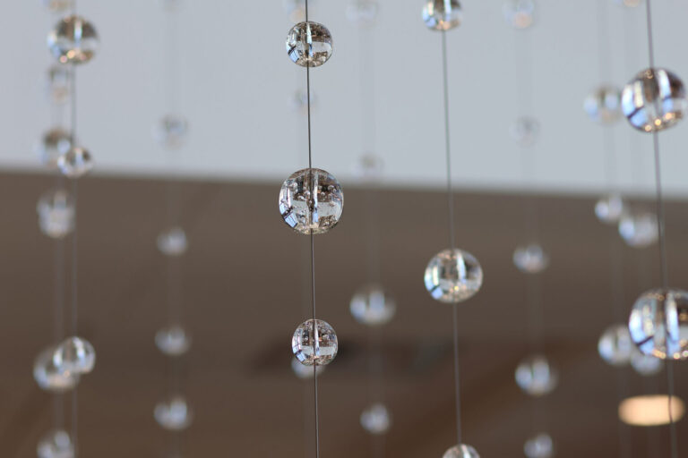 Waterfall: Ice to Clarity, suspended glass installation by Kana Tanaka at Enloe Health Gonzales Comprehensive Cancer Center in Chico, California