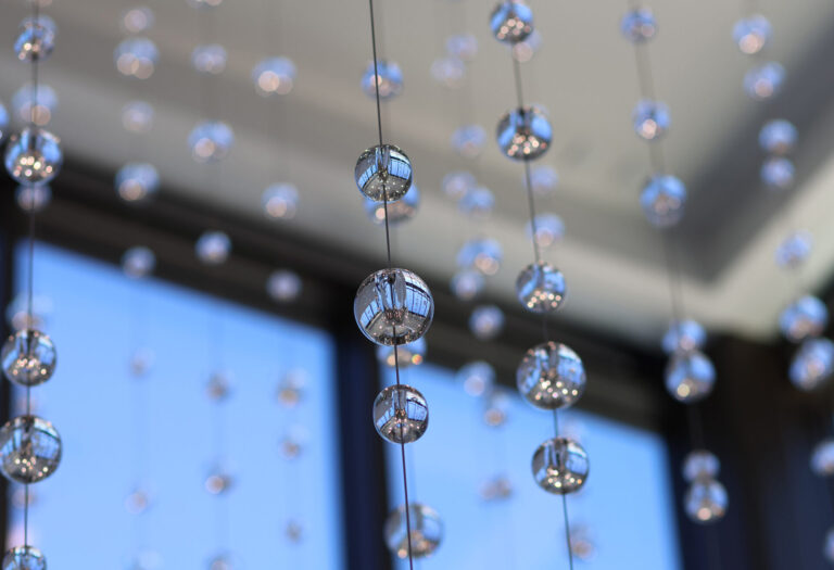 Waterfall: Ice to Clarity, suspended glass installation by Kana Tanaka at Enloe Health Gonzales Comprehensive Cancer Center in Chico, California