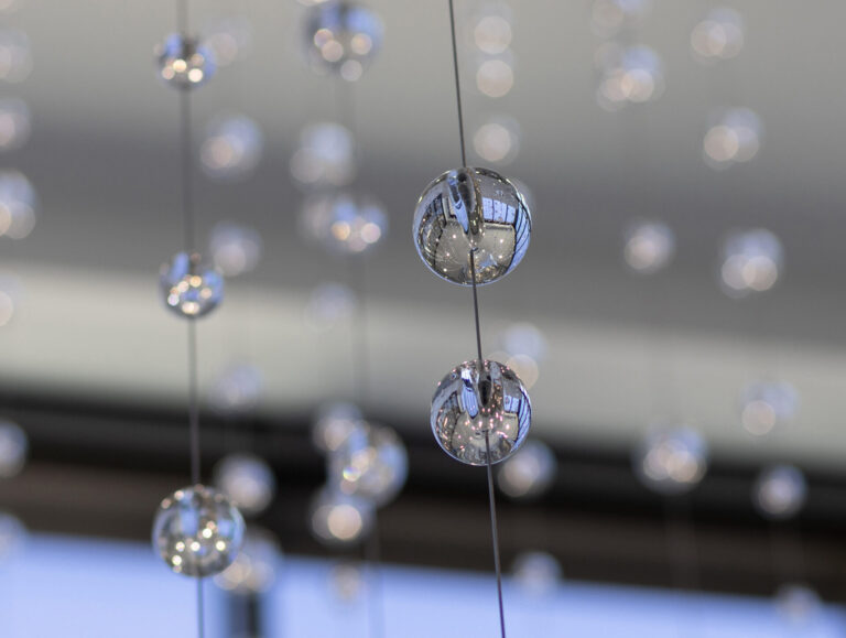 Waterfall: Ice to Clarity, suspended glass installation by Kana Tanaka at Enloe Health Gonzales Comprehensive Cancer Center in Chico, California