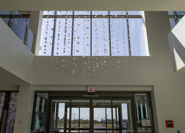 Waterfall: Ice to Clarity, Enloe Health Gonzales Comprehensive Cancer Center, Chico, CA---view toward entrance