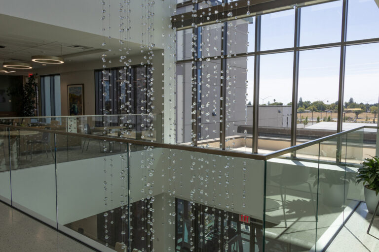 Waterfall: Ice to Clarity, suspended glass installation by Kana Tanaka at Enloe Health Gonzales Comprehensive Cancer Center in Chico, California