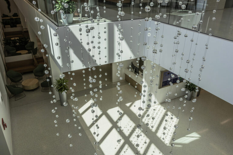 Waterfall: Ice to Clarity, suspended glass installation by Kana Tanaka at Enloe Health Gonzales Comprehensive Cancer Center in Chico, California