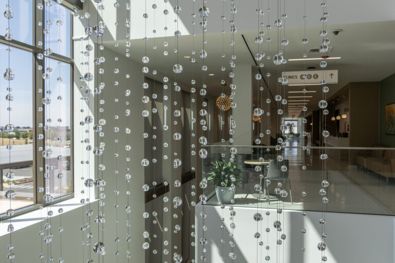 Waterfall: Ice to Clarity, suspended glass installation by Kana Tanaka at Enloe Health Gonzales Comprehensive Cancer Center in Chico, California